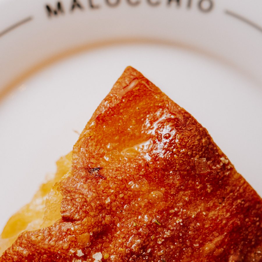 Sourdough focaccia on a branded Malocchio plate